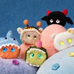 Five Fuzozos dressed in plush hats and outfits