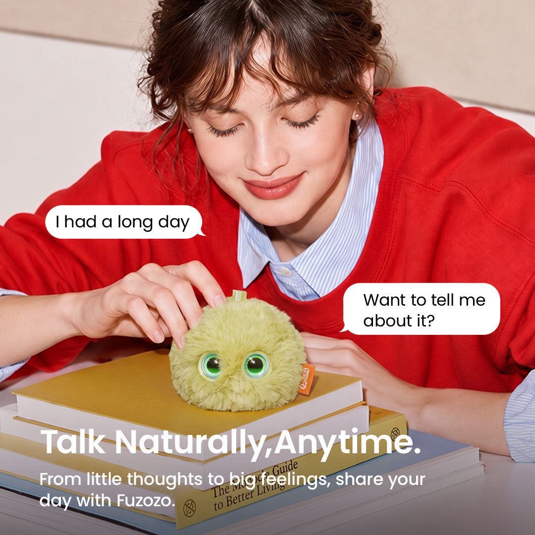 A person sharing their day with a green Fuzozo