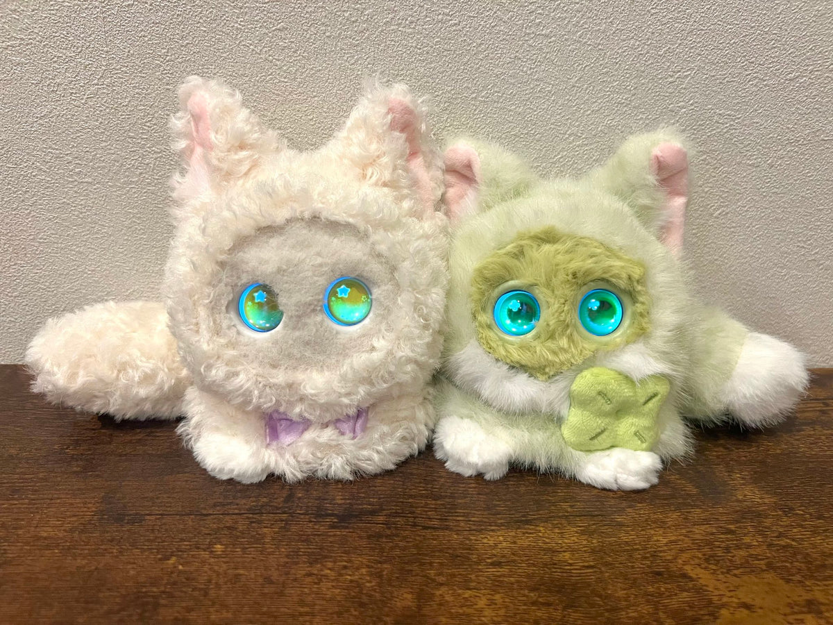 White and green Fuzozos in bunny outfits